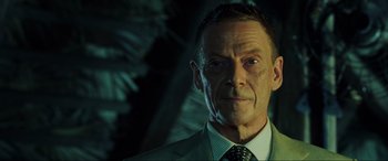 Movie still from “Casino Royale” (2006), directed by Martin Campbell – A person wearing a suit and tie; Close Up shot, Low angle