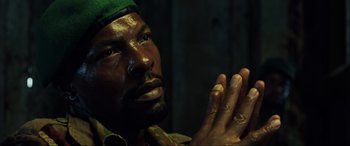 Movie still from “Casino Royale” (2006), directed by Martin Campbell – A person with his hands clasped together; Close Up shot, Low angle