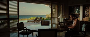 Movie still from “Casino Royale” (2006), directed by Martin Campbell – A view of the ocean from a room at a resort; Wide shot, High angle
