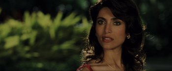 Movie still from “Casino Royale” (2006), directed by Martin Campbell – A person wearing a red dress; Close Up shot, Over the shoulder angle