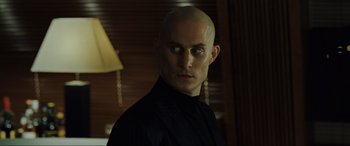 Movie still from “Casino Royale” (2006), directed by Martin Campbell – A man with a bald head is looking at the camera; Close Up shot, Low angle