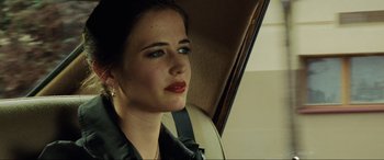 Movie still from “Casino Royale” (2006), directed by Martin Campbell – A woman sitting in the back seat of a car; Close Up shot, Over the shoulder angle