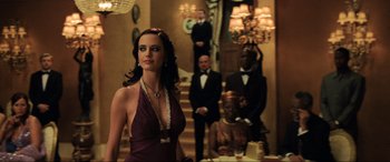 Movie still from “Casino Royale” (2006), directed by Martin Campbell – A group of people standing in a room; Medium shot, Over the shoulder angle