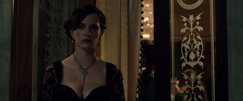 Movie still from “Casino Royale” (2006), directed by Martin Campbell – A woman in a black dress standing in front of a mirror; Close Up shot, Over the shoulder angle