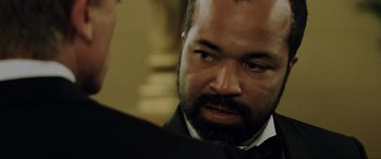 Movie still from “Casino Royale” (2006), directed by Martin Campbell – A person wearing a suit and tie; Close Up shot, Over the shoulder angle