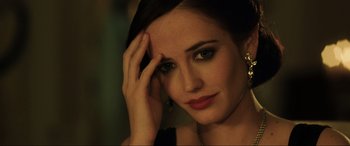 Movie still from “Casino Royale” (2006), directed by Martin Campbell – A beautiful woman with dark brown hair and green eyes; Close Up shot, Over the shoulder angle