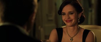 Movie still from “Casino Royale” (2006), directed by Martin Campbell – A woman sitting in front of a man in front of a mirror; Close Up shot, Over the shoulder angle