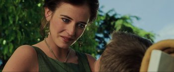 Movie still from “Casino Royale” (2006), directed by Martin Campbell – A person wearing a green dress; Close Up shot, Over the shoulder angle
