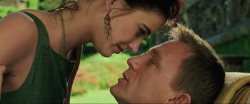Movie still from “Casino Royale” (2006), directed by Martin Campbell – A man and a woman face to face in a field; Close Up shot, Low angle