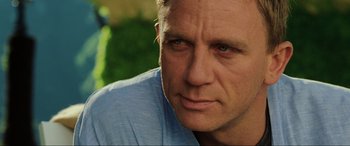 Movie still from “Casino Royale” (2006), directed by Martin Campbell – A man's face in a blue shirt; Close Up shot, Over the shoulder angle