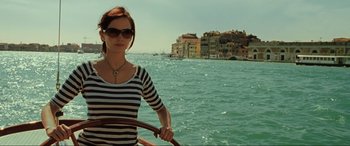 Movie still from “Casino Royale” (2006), directed by Martin Campbell – A woman standing on the side of a boat in the water; Medium shot, Low angle