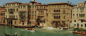 Movie still from “Casino Royale” (2006), directed by Martin Campbell – A large body of water near a building; Extreme Wide shot, High angle