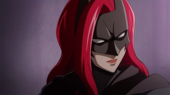 A person wearing a bat mask