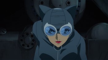 A woman in a cat costume with a cat mask on her head