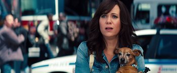 Movie still from “The Secret Life of Walter Mitty” (2013), directed by Ben Stiller – A woman holding a small brown dog in her arms; Close Up shot, Over the shoulder angle