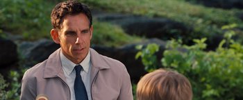 Movie still from “The Secret Life of Walter Mitty” (2013), directed by Ben Stiller – A man wearing a suit and tie standing next to a child; Close Up shot, Over the shoulder angle