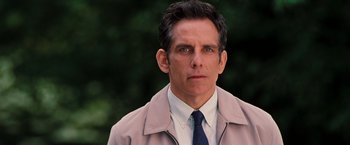 Movie still from “The Secret Life of Walter Mitty” (2013), directed by Ben Stiller – Ben stiller in a suit and tie in front of trees; Close Up shot, Over the shoulder angle