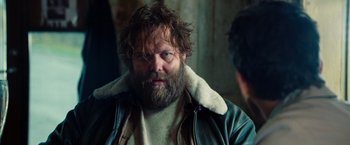 Movie still from “The Secret Life of Walter Mitty” (2013), directed by Ben Stiller – A man with a beard and a jacket on; Close Up shot, Over the shoulder angle