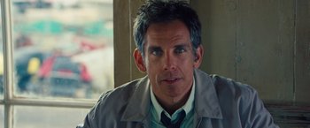 Movie still from “The Secret Life of Walter Mitty” (2013), directed by Ben Stiller – A person wearing a jacket and tie; Close Up shot, Over the shoulder angle