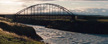 Movie still from “The Secret Life of Walter Mitty” (2013), directed by Ben Stiller – A bridge over a body of water near a body of water; Extreme Wide shot, High angle