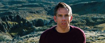 Movie still from “The Secret Life of Walter Mitty” (2013), directed by Ben Stiller – A person wearing a sweater near a mountain; Close Up shot, Over the shoulder angle