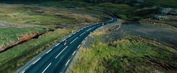 Movie still from “The Secret Life of Walter Mitty” (2013), directed by Ben Stiller – An aerial view of a car driving down a curvy road; Extreme Wide shot, High angle