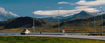 Movie still from “The Secret Life of Walter Mitty” (2013), directed by Ben Stiller – A view of a road with mountains in the background; Extreme Wide shot, High angle