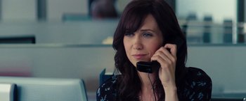 Movie still from “The Secret Life of Walter Mitty” (2013), directed by Ben Stiller – A woman holding a phone up to her ear; Close Up shot, Over the shoulder angle