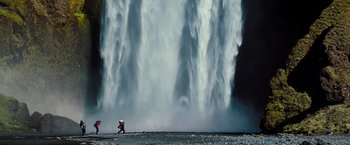 Movie still from “The Secret Life of Walter Mitty” (2013), directed by Ben Stiller – A person standing in front of a large waterfall; Extreme Wide shot, High angle