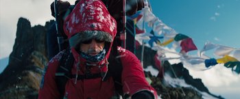 Movie still from “The Secret Life of Walter Mitty” (2013), directed by Ben Stiller – A man in a red coat and a red hat; Close Up shot, Low angle