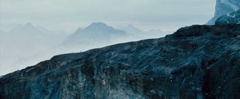Movie still from “The Secret Life of Walter Mitty” (2013), directed by Ben Stiller – A person is standing on a mountain top looking out at the sky; Extreme Wide shot, High angle
