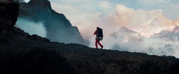Movie still from “The Secret Life of Walter Mitty” (2013), directed by Ben Stiller – A person with a backpack walking on a mountain; Extreme Wide shot, Low angle