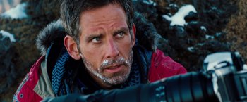 Movie still from “The Secret Life of Walter Mitty” (2013), directed by Ben Stiller – A person wearing a jacket with snow on his face; Close Up shot, Over the shoulder angle
