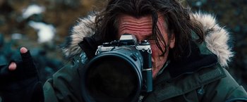 Movie still from “The Secret Life of Walter Mitty” (2013), directed by Ben Stiller – A man taking a picture with a camera; Close Up shot, Over the shoulder angle