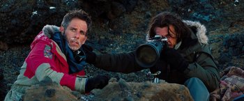 Movie still from “The Secret Life of Walter Mitty” (2013), directed by Ben Stiller – A man and a woman are holding a camera and posing for a picture; Medium shot, Over the shoulder angle