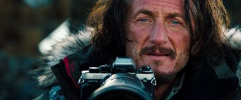 Movie still from “The Secret Life of Walter Mitty” (2013), directed by Ben Stiller – A person holding a camera; Close Up shot, Low angle