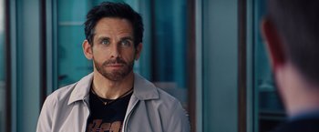 Movie still from “The Secret Life of Walter Mitty” (2013), directed by Ben Stiller – A person wearing a jacket; Close Up shot, Over the shoulder angle