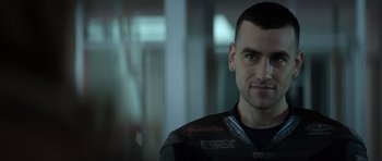 Movie still from “Centaur” (2022), directed by Daniel Calparsoro – A person wearing a uniform; Close Up shot, Low angle