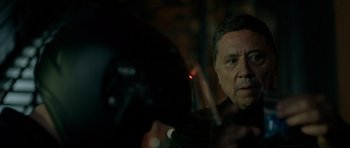 Movie still from “Centaur” (2022), directed by Daniel Calparsoro – A person with a microphone; Close Up shot, Over the shoulder angle