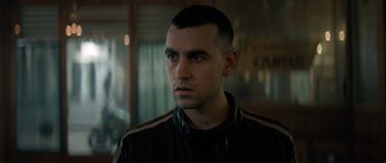 Movie still from “Centaur” (2022), directed by Daniel Calparsoro – A person wearing a jacket; Close Up shot, Over the shoulder angle