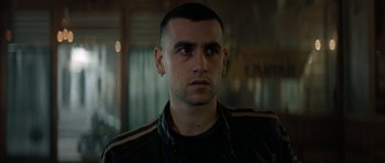 Movie still from “Centaur” (2022), directed by Daniel Calparsoro – A person wearing a jacket; Close Up shot, Over the shoulder angle