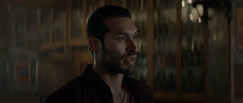 Movie still from “Centaur” (2022), directed by Daniel Calparsoro – A person with a beard; Close Up shot, Over the shoulder angle