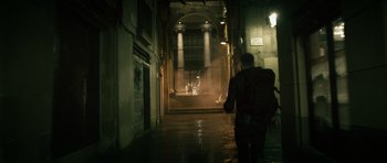 Movie still from “Centaur” (2022), directed by Daniel Calparsoro – A man walking down a street at night; Wide shot, Low angle