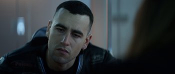 Movie still from “Centaur” (2022), directed by Daniel Calparsoro – A person wearing a black jacket; Close Up shot, Over the shoulder angle