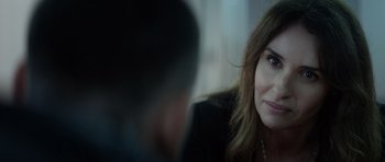 Movie still from “Centaur” (2022), directed by Daniel Calparsoro – A person sitting in front of another person; Close Up shot, Over the shoulder angle