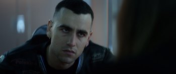 Movie still from “Centaur” (2022), directed by Daniel Calparsoro – A person wearing a black jacket; Close Up shot, Over the shoulder angle