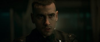 Movie still from “Centaur” (2022), directed by Daniel Calparsoro – A person wearing a black shirt; Close Up shot, Low angle