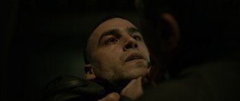 Movie still from “Centaur” (2022), directed by Daniel Calparsoro – A person wearing a motorcycle jacket; Close Up shot, Low angle