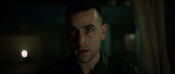 Movie still from “Centaur” (2022), directed by Daniel Calparsoro – A person wearing a green shirt; Close Up shot, Low angle