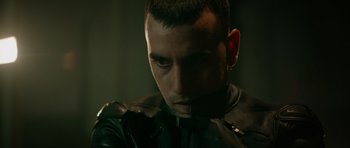 Movie still from “Centaur” (2022), directed by Daniel Calparsoro – A person wearing a leather jacket; Close Up shot, Low angle